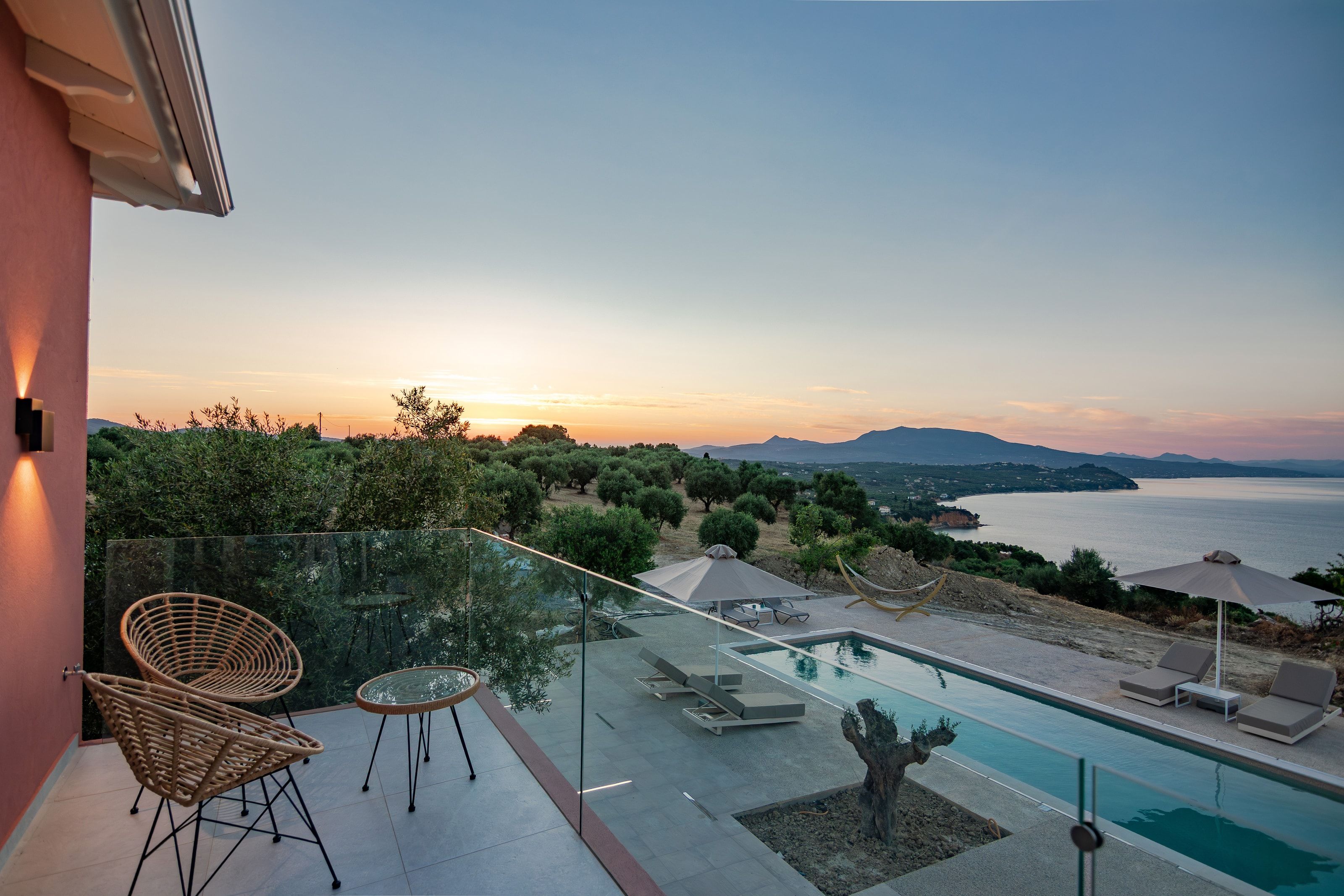 First-floor balcony at sunset, looking over the pool to the gulf